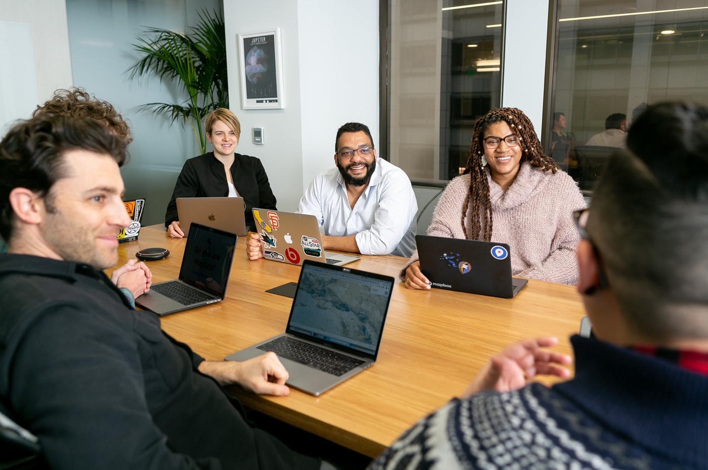 A group of developers talking in a conference room