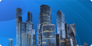 A set of city skyscrapers in front of a blue background.